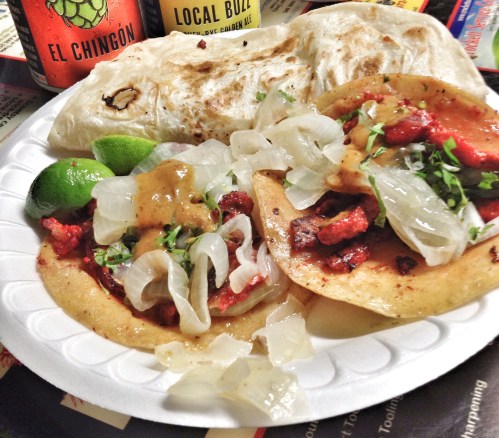 Tacos de trompo and a gringa at Dos Primos Tacos.